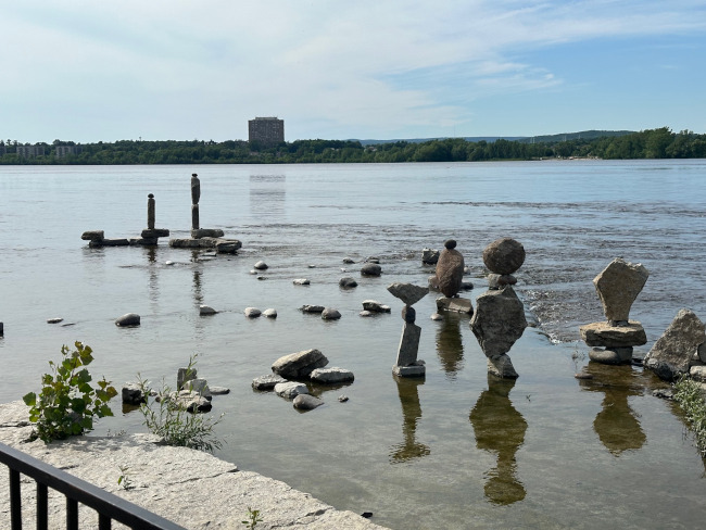 some stone figures in the water